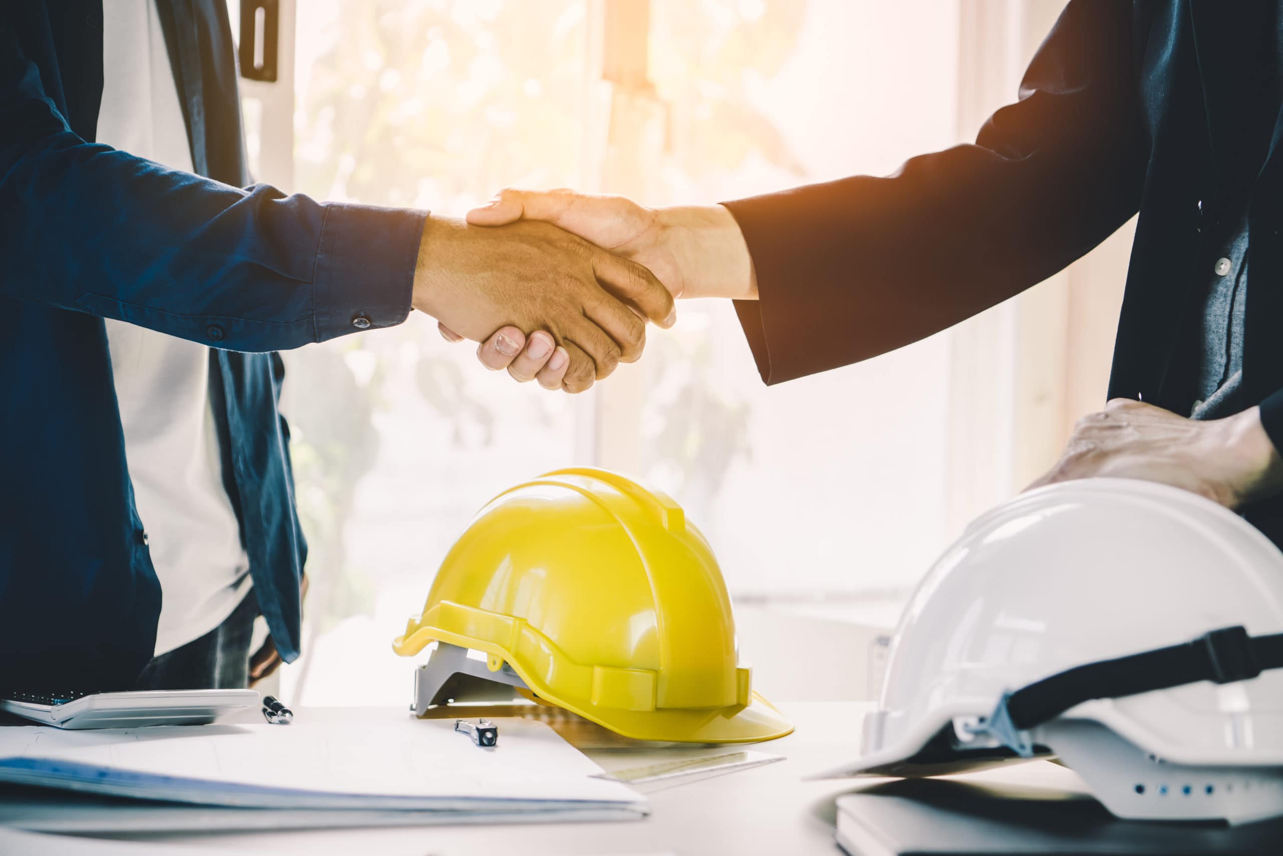 Workers shaking hands